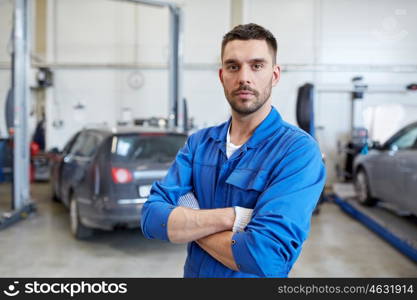 car service, repair, maintenance and people concept - auto mechanic man or smith at workshop