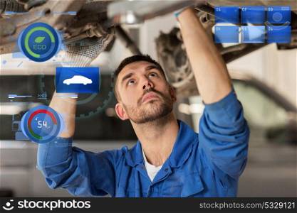 car service, repair, maintenance and people concept - auto mechanic man or smith working at workshop. mechanic man or smith repairing car at workshop