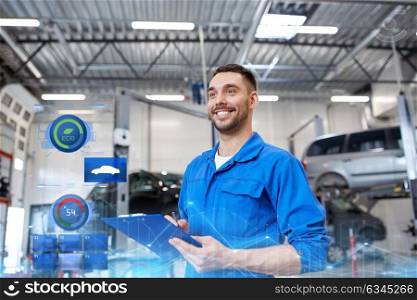 car service, repair, maintenance and people concept - happy smiling auto mechanic man or smith with clipboard at workshop. happy mechanic man with clipboard at car workshop