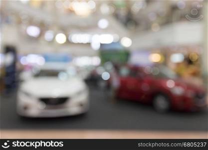 car showing in showroom for sale, blur background with bokeh light