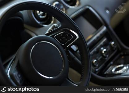 Car steering wheel. Interior view of car with black salon