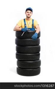 Car tire service repairman, white background, garage worker with tyres, wheel mounting. Tire service, repairman hand up, white background