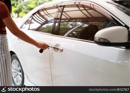 car unlocks, woman use key to open the car door