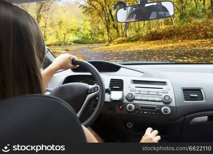 car windscreen with country autumn road, view inside out. car windscreen with road