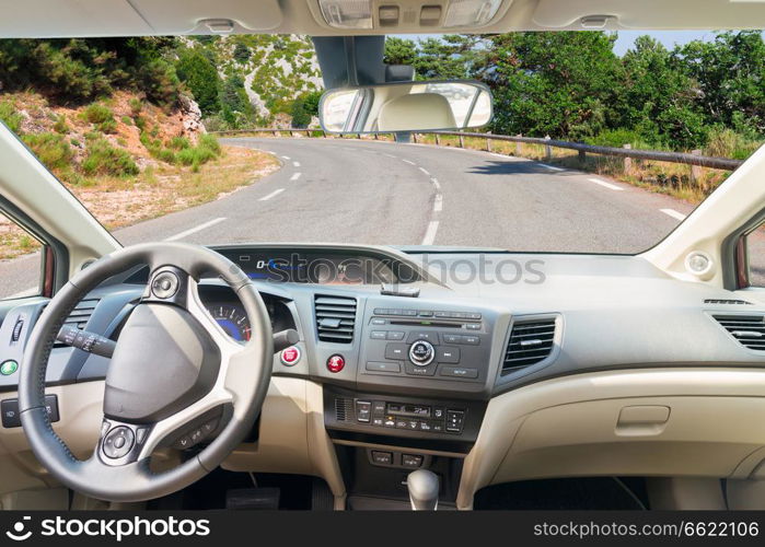 car windscreen with country road, view inside out. car windscreen with road