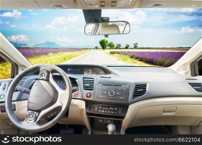 car windscreen with country summer road, view inside out. car windscreen with road