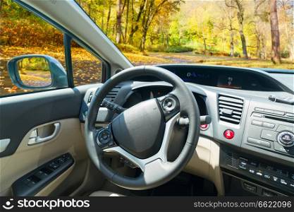car windscreen with fall road, view inside out. car windscreen with road