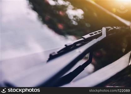 Car wiper of car parked on street sunlight background
