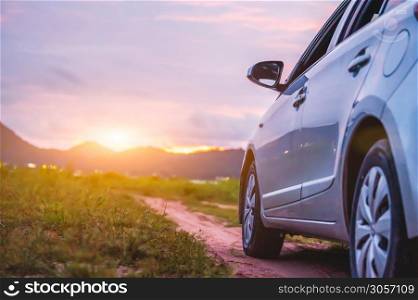 Car with mountain and grassland landscape. Travel and transport concept.