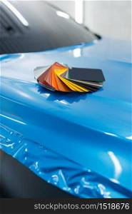 Car wrapping, protective vinyl foil or film color palette on the vehicle, nobody. Auto detailing. Automobile paint protection, professional tuning. Car wrapping, foil or film color palette, nobody