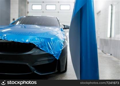 Car wrapping, protective vinyl foil or film installation on the vehicle, nobody. Auto detailing. Automobile paint protection, professional tuning. Car wrapping, protective foil or film installation