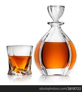 Carafe and glass of whiskey isolated on a white background