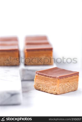 Caramel and biscuit shortcake bites dessert on marble board