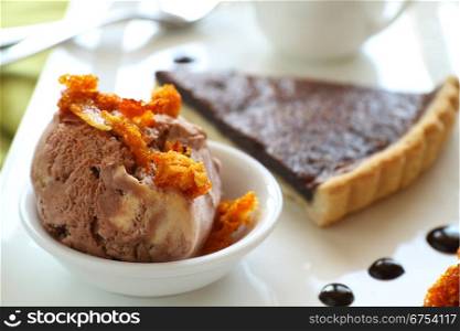 Caramel ice cream with honeycomb and chocolate tart with sauce.