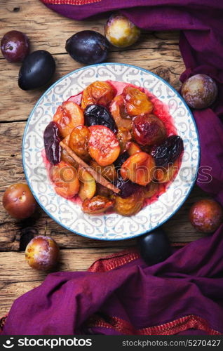 caramelized autumn plum. autumn dessert with plums baked in sweet caramel