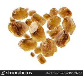 Caramelized sugar in the shape of a heart on a white background.. Caramelized sugar in the shape of a heart on a white background