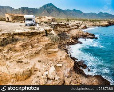 Caravan camping on cliff sea shore. Mediterranean region of Mazarron, Sierra de las Moreras in Murcia Spain.. Camper car on coast, Murcia Spain