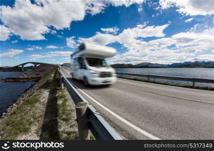 "Caravan car RV travels on the highway. Caravan Car in motion blur. Norway. Atlantic Ocean Road or the Atlantic Road (Atlanterhavsveien) been awarded the title as "Norwegian Construction of the Century"."