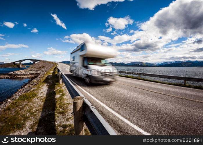 Caravan car RV travels on the highway Norway. Atlantic Ocean Road or the Atlantic Road (Atlanterhavsveien) been awarded the title as (Norwegian Construction of the Century).