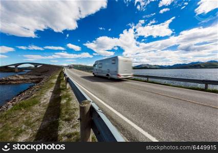 Caravan car travels on the highway. Atlantic Ocean Road or the Atlantic Road (Atlanterhavsveien) been awarded the title as (Norwegian Construction of the Century).
