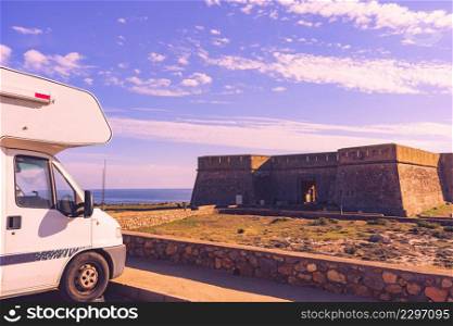 Caravan on coastal fortification, castle near the town of Los Banos de Guardias Viejas, Almeria province, Andalusia Spain. Tourist place.. Caravan at old guards castle, Almeria Spain