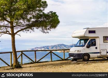 Caravan on spanish coast, seaside cliffs of Maro Cerro Gordo. Costa del Sol, Andalusia Spain. Vacation with motor home. Caravan on seaside cliff, Spain