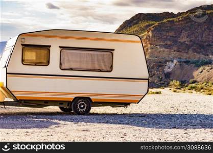 Caravan trailer camping in mountain nature. Travelling, vacation with mobile home.. Caravan trailer in mountain nature
