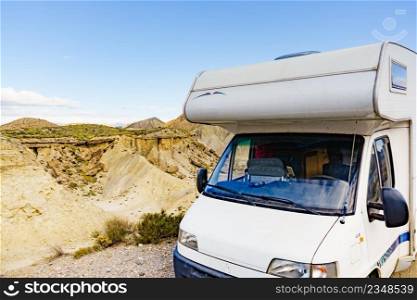 Caravan vehicle c&ing in Tabernas desert. Almeria province, Andalusia Spain. Traveling in mobile home.. C&er rv in Tabernas desert nature, Spain