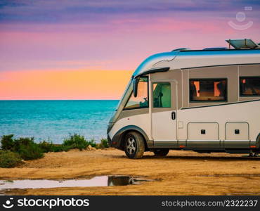 Caravan vehicle camping on mediterranean coast in Spain. Vacation in motorhome.. Camper rv on spanish coast