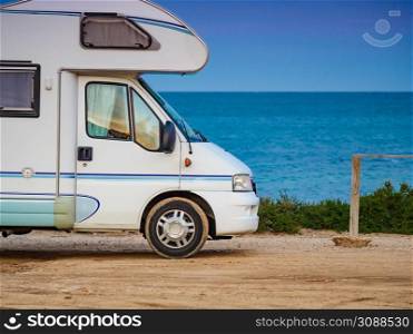 Caravan vehicle camping on mediterranean coast in Spain. Vacation in motorhome.. Camper rv on spanish coast