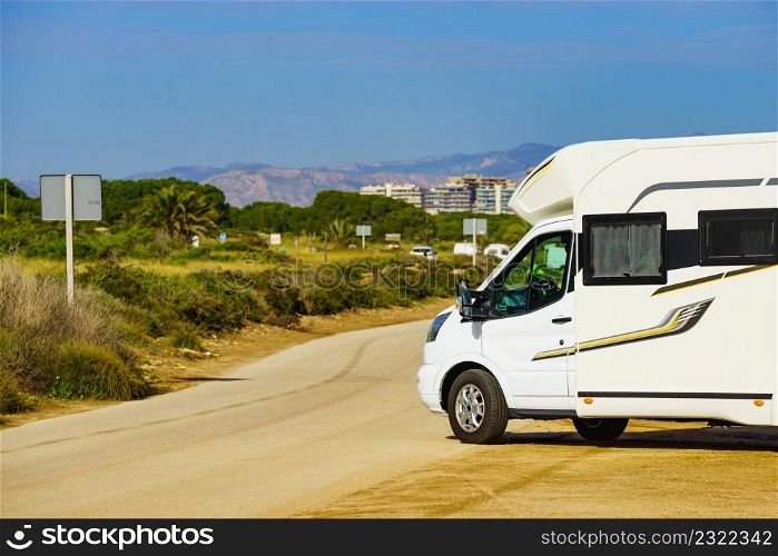 Caravan wild camping on mediterranean coast of Spain. Holidays, traveling with motorhome.. Caravan camping on mediterranean coast.