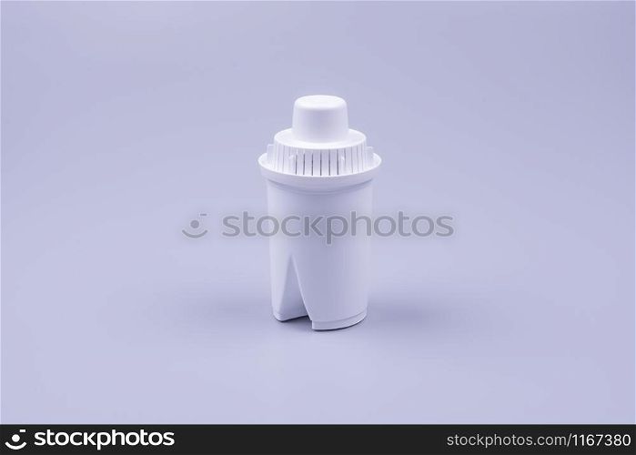 carbon filter for water, white, close-up photo on a gray background. carbon filter for water