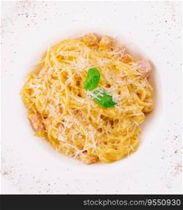 Carbonara pasta isolated on white top view