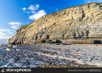 Carboniferous limestone cliffs of Southerndown Beach or Dunraven Bay, afternoon light. Used as Bad Wolf Bay in Doctor Who. South Wales, UK.