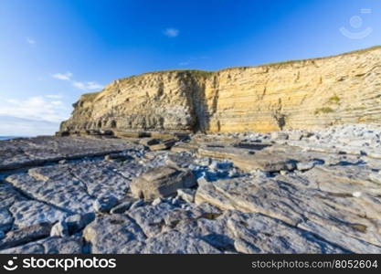 Carboniferous limestone cliffs of Southerndown Beach or Dunraven Bay, afternoon light. Used as Bad Wolf Bay in Doctor Who. South Wales, UK.