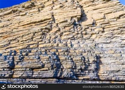 Carboniferous limestone cliffs of Southerndown Beach or Dunraven Bay, afternoon light. Used as Bad Wolf Bay in Doctor Who. South Wales, UK.