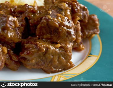 carbonnade de boeuf a la Flamande with mashed potatoes. traditional Belgian sweet-sour beef and onion stew made with beer, and seasoned with thyme, bay and mustard.