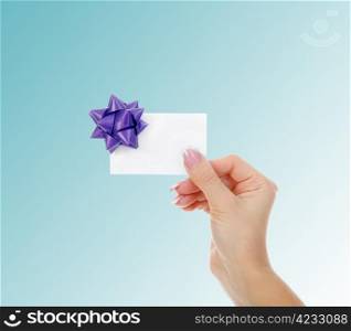 card blank in women hand. on color background