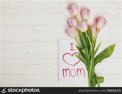 card i love mom flowers placed white wood table 2. Resolution and high quality beautiful photo. card i love mom flowers placed white wood table 2. High quality beautiful photo concept