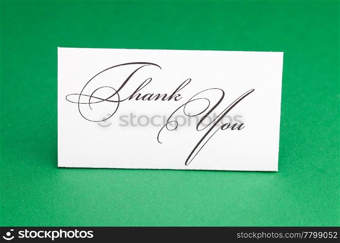 card signed thank you on green background