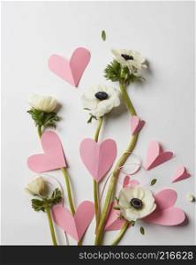 card with flowers and pink hearts on Valentine&rsquo;s Day. flowers and hearts