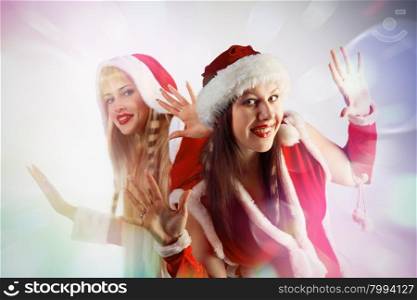 card with two beautiful Santa girls. Abstract background