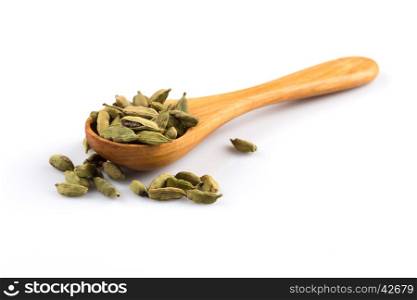 Cardamom in wooden spoon isolated on a white background