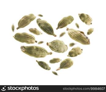 Cardamom pods in the shape of a heart on a white background.. Cardamom pods in the shape of a heart on a white background