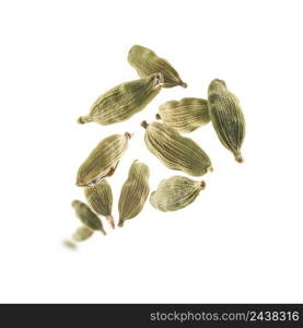 Cardamom pods levitate on a white background.. Cardamom pods levitate on a white background