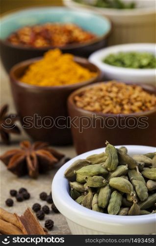 Cardamom seeds and a selection of spices used in cooking