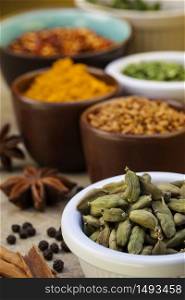 Cardamom seeds and a selection of spices used in cooking