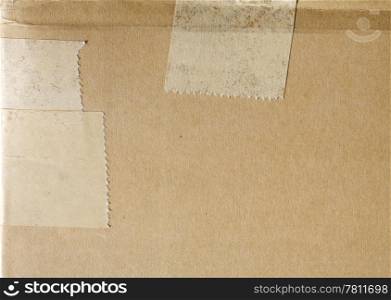 Cardboard background with some adhesive tape