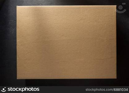 cardboard box on black background