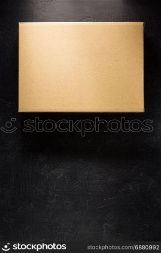 cardboard box on black background surface